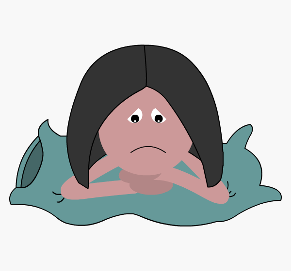 Sad woman with head on pillow